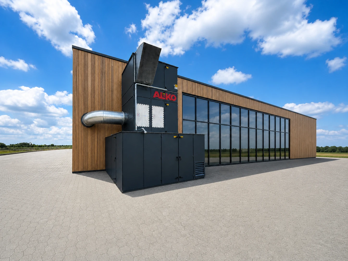 Stationäre Absauganlage an einer modernen Industriehalle